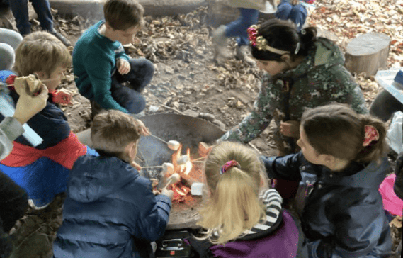 Pupils toasting marshmallows in Forest School