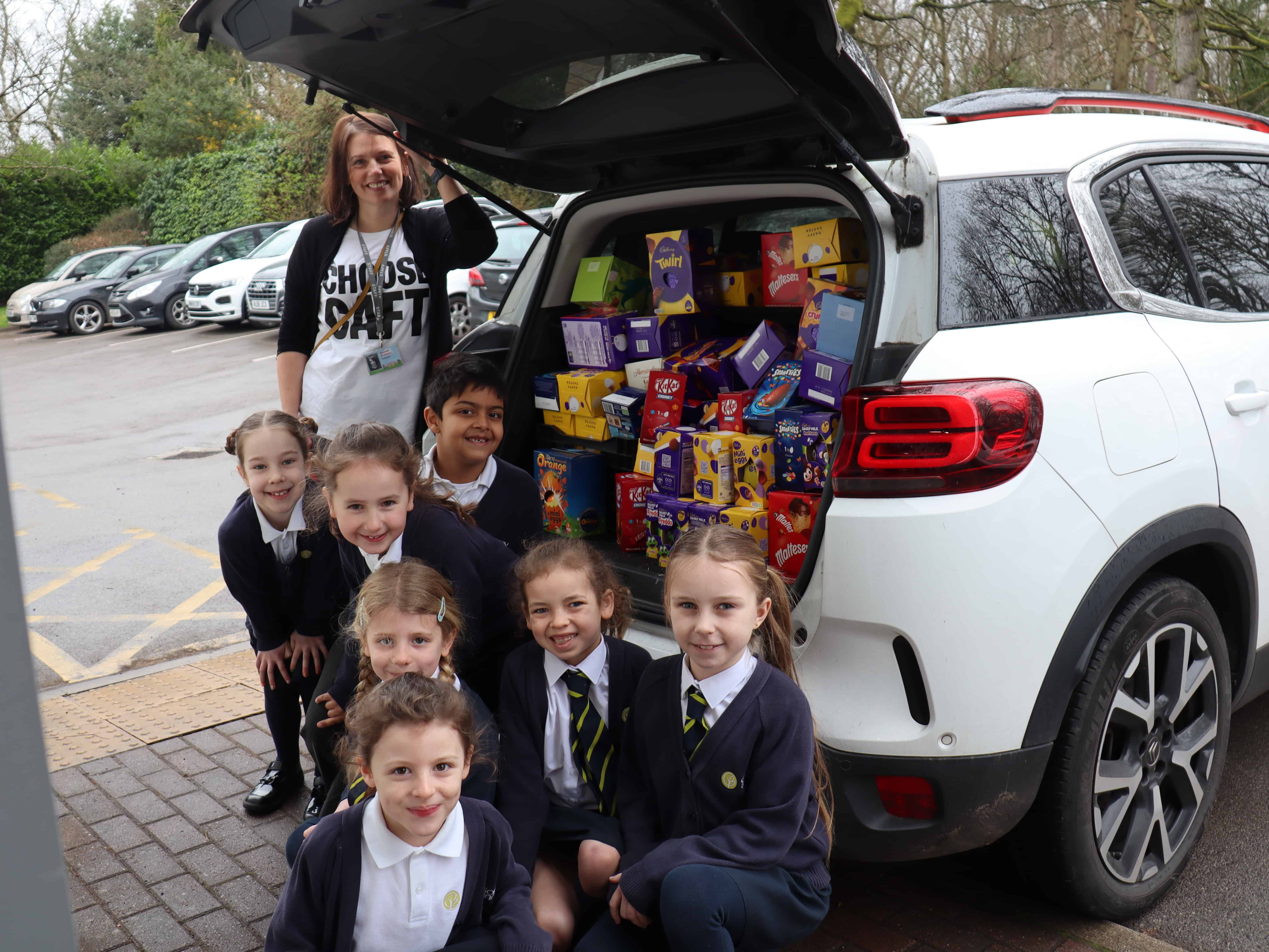 Gorsey Bank Primary School pupils donating easter eggs to their school charity, CAFT.
