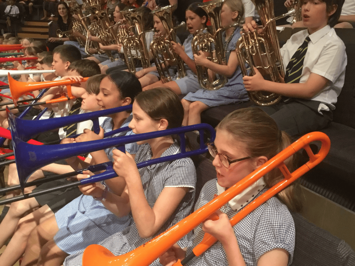 Year 5 pupils from Gorsey Bank sit in the Bridgewater Hall with their trumpets and brass ready to play alongside the Halle orchestra