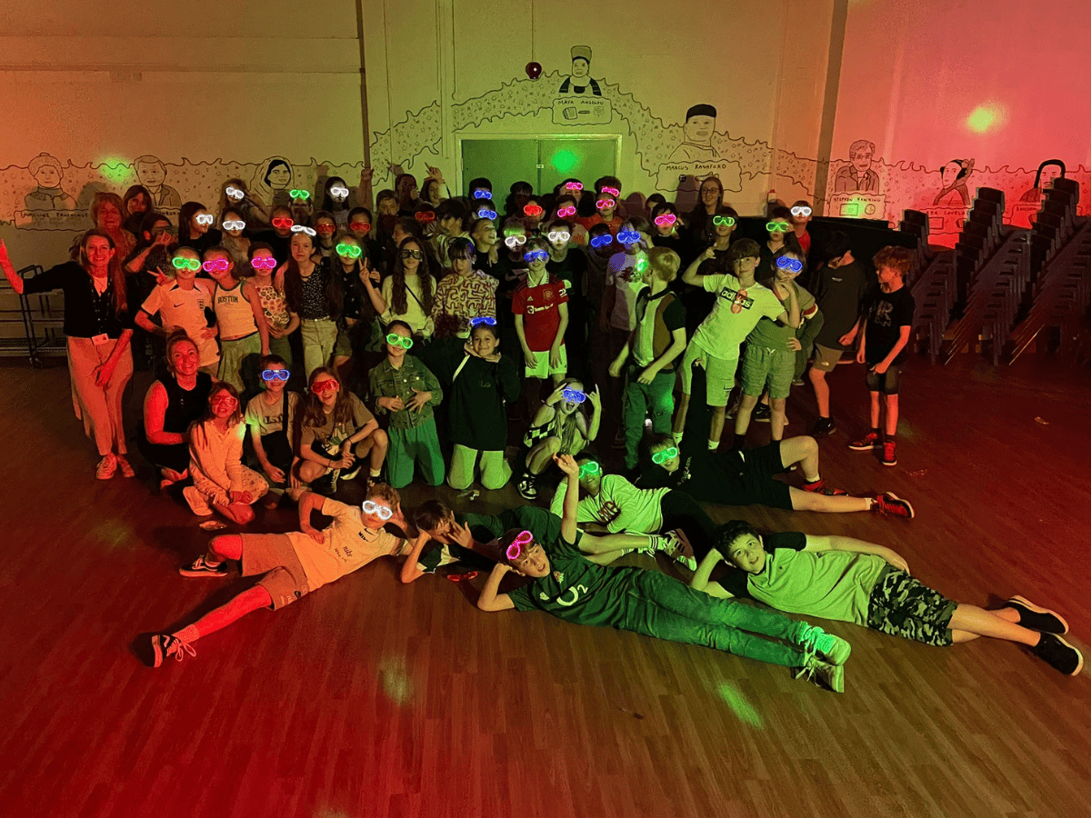 Gorsey Bank Year 6 pupils pose in disco lights at their Leavers Disco