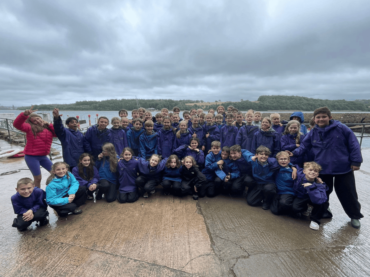 Year 6 pupils from Gorsey Bank all smile for a group photo ahead of their raft building session